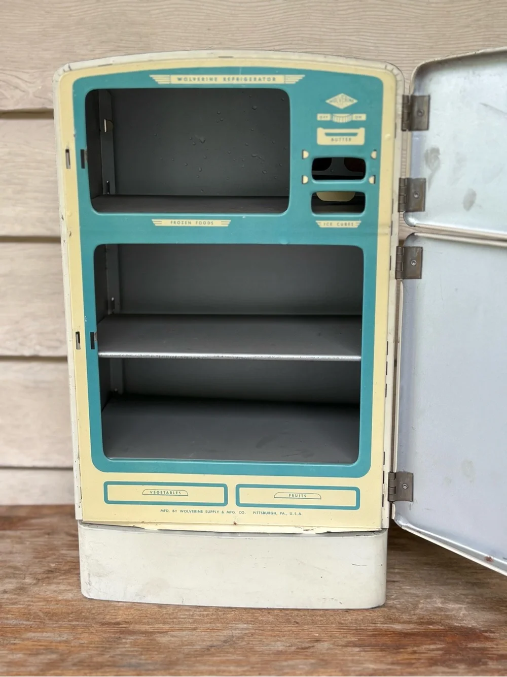 VTG 1950s Wolverine Supply metal toy refrigerator, featuring a white finish